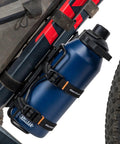 Outpost Cargo Water Bottle Cage With Triple Mount Holes And Straps To Secure Odd Size Bottles on a bike frame