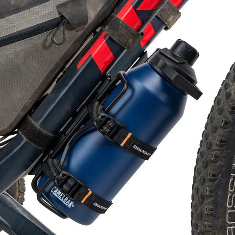 Outpost Cargo Water Bottle Cage With Triple Mount Holes And Straps To Secure Odd Size Bottles on a bike frame