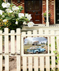 Vintage Blue Farm Truck Metal Tin Sign Rustic Country Farmhouse Wall Decor Floral Old Pickup Scene Retro Plaque For Garage Barn Decor 12x8 Inch Garden Style on a white fence.