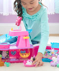Child playing with Bowdazzling Minnie Mouse Yacht Playset With Lights And Sounds 14 Piece Boat Set including figures and accessories