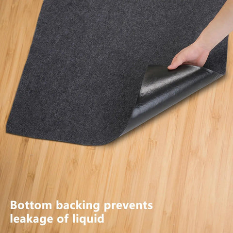 Person lifting corner of Outdoor Storage Shed Mat For Patio And Carport, Waterproof And Dustproof Non Slip Backing Keeps Liquids Out