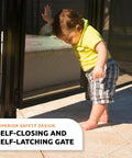Child interacting with the Super Simple Diy Self Closing Gate Kit For Pool Safety Fencing, black aluminum frame, self-closing design.