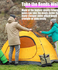 Two people setting up a yellow tent using Fiberglass Tent Pole Replacement Kit 12 Ft Pre Assembled Black Outdoor Tent Pole for Hiking and Camping