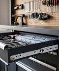 Tough As A Bull Heavy Duty 6 Pair 16 Inch Bottom Mount Drawer Slides Featuring Hella Smooth Self Closing Action Rust Resistant White Powder Coated Steel Tracks For Kitchen Or Bath Setup with organized tools in a workshop drawer.