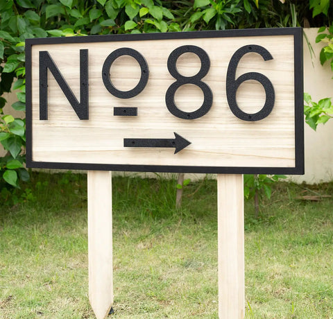 8 Inch Floating Black House Numbers For Outside on a wooden sign with NO 86, featuring modern design for outdoor use.