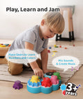 Child using Screen Free Kids DJ Mixer And Manual Music Gear Station Featuring Twin Beat Sliders Scratch Wheel And Interactive Ear Training.