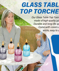 Glass Tabletop Torch Set Four Pack For Outdoor Use With 13.5 Oz Citronella Fuel displayed on a patio table during daytime