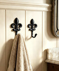 Top Shelf 2 Pack Black Wall Hooks for Kitchen and Bathroom, Vintage Farmhouse Decor, Heavy Duty and Sturdy Coat and Towel Hooks with Classic Matte Finish that brings Badass Charm to any Room, displaying towel.