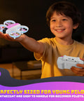 Child holding Compact Mini Drone With Built In Two Point Four Inch Screen Remote No App Needed 720P Dual Camera indoors