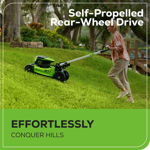 Person using 60V Brushless Self Propelled Cordless Lawn Mower With 21 Inch Deck Two 4.0Ah Batteries on a grassy slope.