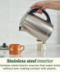 Person pouring water from PerfecTemp 1.7 Liter Electric Kettle Cordless With 1500W Fast Heat Up And 6 Preset Temperatures into a cup