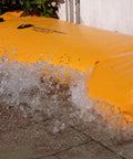 HydraBarrier Supreme 6 Foot Flood Barrier 12 Inch High Portable Water Diversion Tube protecting door from floodwater.