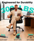 Man sitting on ergonomic breathable mesh desk chair with adjustable lumbar support and flip-up armrests, high-back comfort