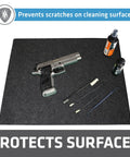 Gun Cleaning Pad 16x20 Inch, Premium Absorbent Cleaning Mat With Waterproof Backing, Rugged Surface Protector That Traps Liquids And Spills, Made In USA, Charcoal, shown with cleaning tools and firearm on surface