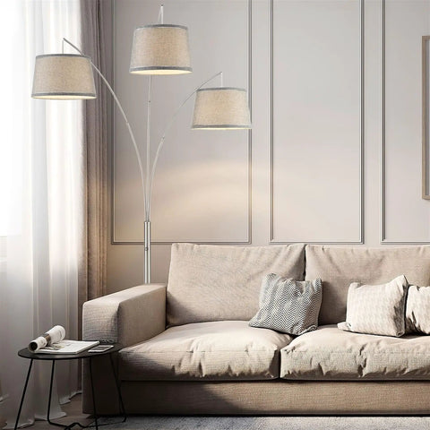Dope Modern Arc Floor Lamp With Three Lights And Three Way Switch Beige Burlap Drum Shades Antique Bronze Finish next to sofa
