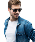 Man wearing Original Wayfarer Polarized Sunglasses with Classic Square Frame Black And Green Lens Combo 50mm Size UV Protection Timeless Icon Eyewear For Men And Women You Can Wear Everyday Durable And Stylish