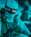 Person wearing Vizz Tactical LED Headlamp 550 Lumen Power IPX7 Waterproof RGB And IR LEDs Regulated Output in cold, dark environment.