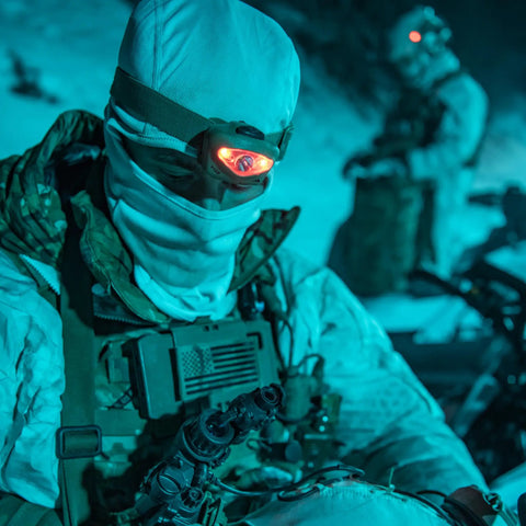 Person wearing Vizz Tactical LED Headlamp 550 Lumen Power IPX7 Waterproof RGB And IR LEDs Regulated Output in cold, dark environment.