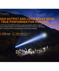 Long-Range Rechargeable Hunting Flashlight 1500 Lumen With 1011 Yards Reach illuminating a dark landscape at night.