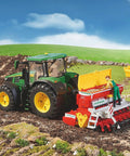 Toy tractor with Vitasem 302ADD Harrow Mounted Seed Drill With Rotating Roller Open Seed Tank on a farm field model