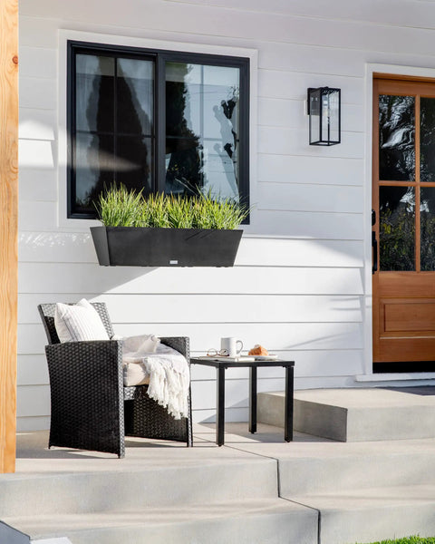 Plastic Railing Planter With Adjustable Brackets For Outdoor Balcony And Fence displayed on porch wall with green plants