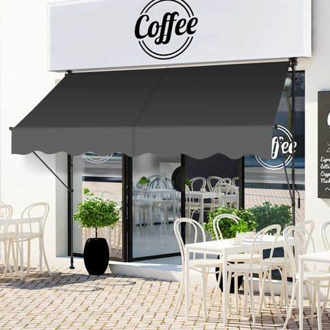 Manual Retractable Patio Awning 118-Inch Adjustable Sun Shade Shelter For Doors Windows Backyard Garden And Balcony With UV Protection And Easy Breezy All Weather Canopy In Gray covering café seating area