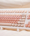 Clean 80 Percent Wireless Mechanical Keyboard In Soft Pink Creamy Build Featuring Jelly Moa Profile Transparent Keycaps And Smooth Linear Switches For Fire PC Gaming And Desk Setup Vibes, top view with highlighted key layout.