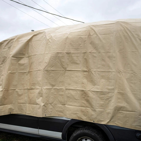 Heavy Duty Waterproof Tarp 20 Ft By 30 Ft 12 Mil Thick Tan Tarp With Reinforced Corners covering a vehicle for protection