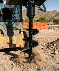 Excavator using Beefy 12 By 52 Inch Auger Drill Bit With 2 Inch Hex Connection for soil boring on construction site