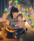 Mother and child under tent with Tropical Flamingo Pineapple Palm Tree LED String Lights, 30 LEDs, 16 Ft Battery Operated, cozy ambiance