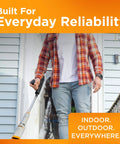 Man using Rocket Cordless Air Broom For Indoor And Outdoor Cleaning by front door
