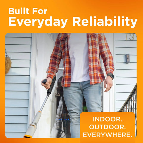 Man using Rocket Cordless Air Broom For Indoor And Outdoor Cleaning by front door