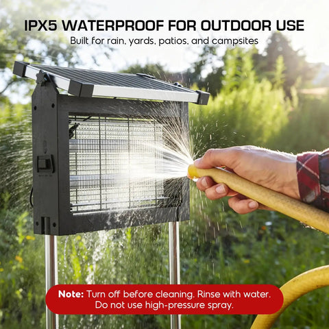 Cordless Solar Bug Zapper With USB Recharge No Fuss 4500V High Power Mosquito Killer With Smart Light Sensor Waterproof Outdoor Insect Trap in use with water spray in a garden.