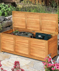 Acacia Wood Deck Box Bench 47 Gallon Outdoor Storage Chest with seating, open lid showing tools, natural finish in garden