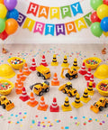 Kick Off Your Events With These Durable Mini Traffic Cones Bulk Pack Designed For Birthday Parties Classroom Drills And Hobby Track Layouts Ready To Roll Anytime Featuring Bold Assorted Colors Straight Up Tough Build set up with toy trucks, bowls of candy, and colorful decorations.