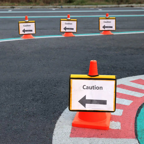 Set Of 12 Yellow Traffic Cone Sleeves With Pockets For Caution Notes And Signs Safety Message Sign Covers on orange traffic cones on pavement