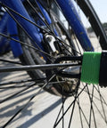 Bicycle wheel secured with green-covered padlock from Colored Waterproof Padlocks Set With Keyed Alike Locks, Heavy Duty Laminated Steel