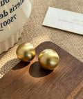 Bold Gold Round Earrings For Women Featuring A Chunky Wide Half Ball Design Lightweight Studs For Everyday Wear Dope Party Ready Glam Vibe Trendy Circle Hoop Look Essential Accessory For Chic Street Style, gold stud pair