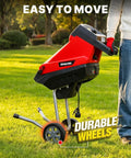 Powerful 15 Amp Electric Wood Chipper Shredder for Easy Yard Cleanup, red and black, on grass with durable wheels