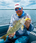Angler holding a walleye caught with Mimic Minnow Swimbait Lure Kit With Jig Head Design Assorted Sizes And Colors For Walleye Bass