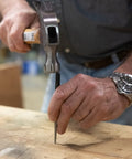 Using 16 Piece Punch And Chisel Set With Pin Punches And Center Punches For Metalwork, Auto Repair And DIY Projects, aligning a pin