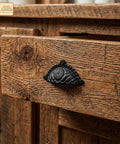 Matte Black Cup Drawer Pulls For Cabinets And Kitchen, shown on rustic wooden drawer, Mystic Colonial Style, cast iron detail, 3.7x2.1 inches