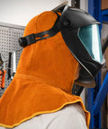 Worker wearing Real Cow Leather Welding Hood Cap, Heat And Spark Resistant Shield Up To 250C under black welding helmet