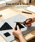 Person cutting Eight Piece Triangle Rug Pads Set 70x70mm No Slip Dual Sided Adhesive Pads For Hardwood Floors Tiles Marble Reusable Rug Tape.
