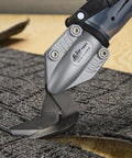 Drill Powered Vinyl Siding Cutter Attachment Turbo Shear cutting through grey material, fits cordless and corded drills.