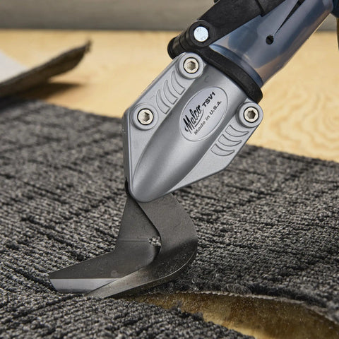 Drill Powered Vinyl Siding Cutter Attachment Turbo Shear cutting through grey material, fits cordless and corded drills.
