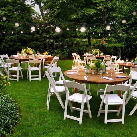 Garden party setup under Solar Powered LED Outdoor String Lights 27 Ft Warm White Edison Bulbs For Patio Backyard Porch Waterproof And Durable Includes 12 Replaceable Bulbs With Detachable Solar Panel 1W Per Bulb For Cozy Outdoor Vibes.