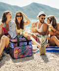 Insulated Picnic Backpack Cooler With 30L Capacity on beach next to group of people enjoying drinks and sun