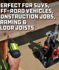 Powerbuilt 3-Ton all-in-one hydraulic bottle jack and jackstand; compact unit with wide base beside a beam.