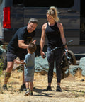 Adults teaching a young boy to ride an Electric Balance Bike For Kids Ages 3 To 5 With 12eDRIVE Gradual Power Start outdoors.